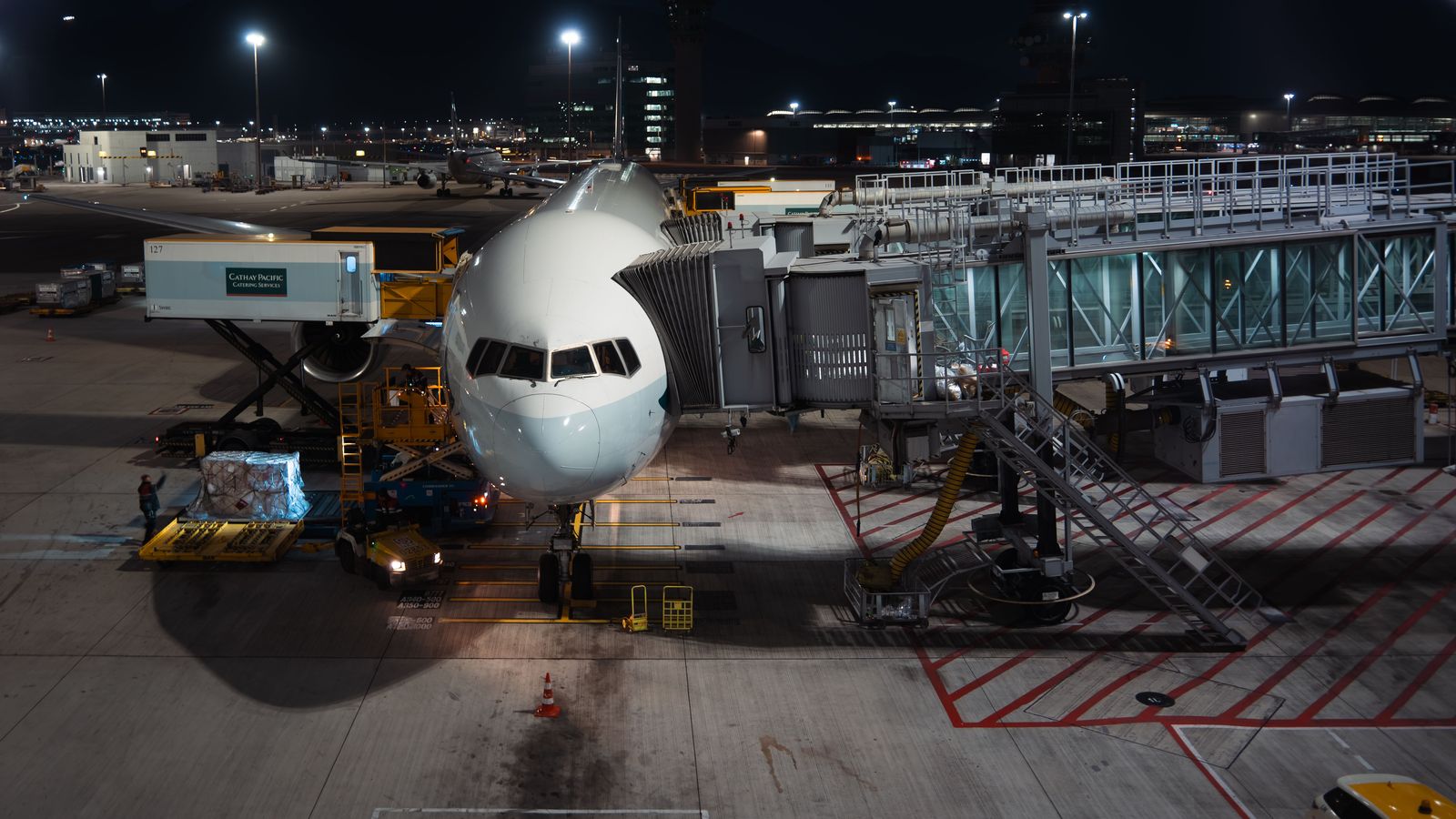 Cargo aircraft being loaded at night