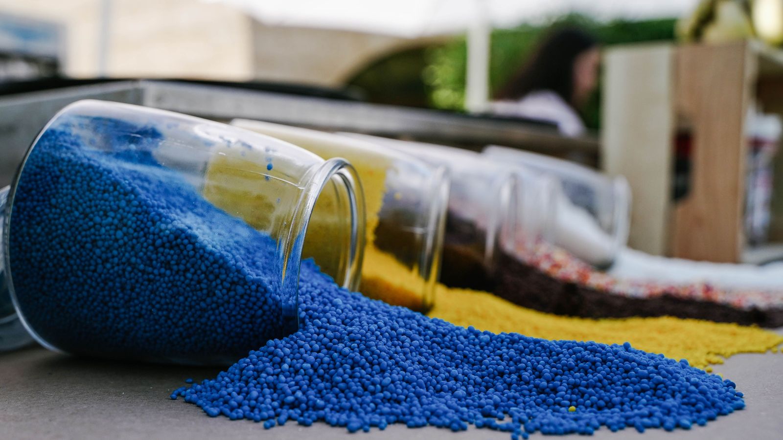 Blue and yellow plastic resin pellets