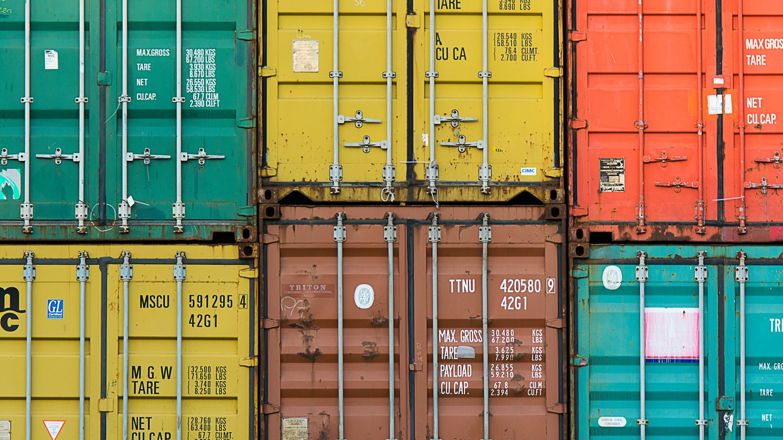 Stacked shipping containers in several colors