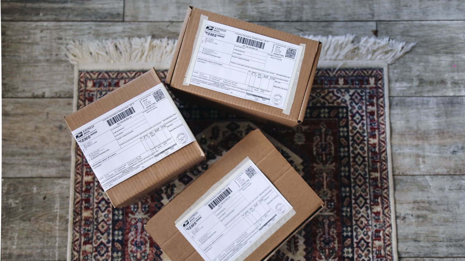 Three shipping parcels with labels